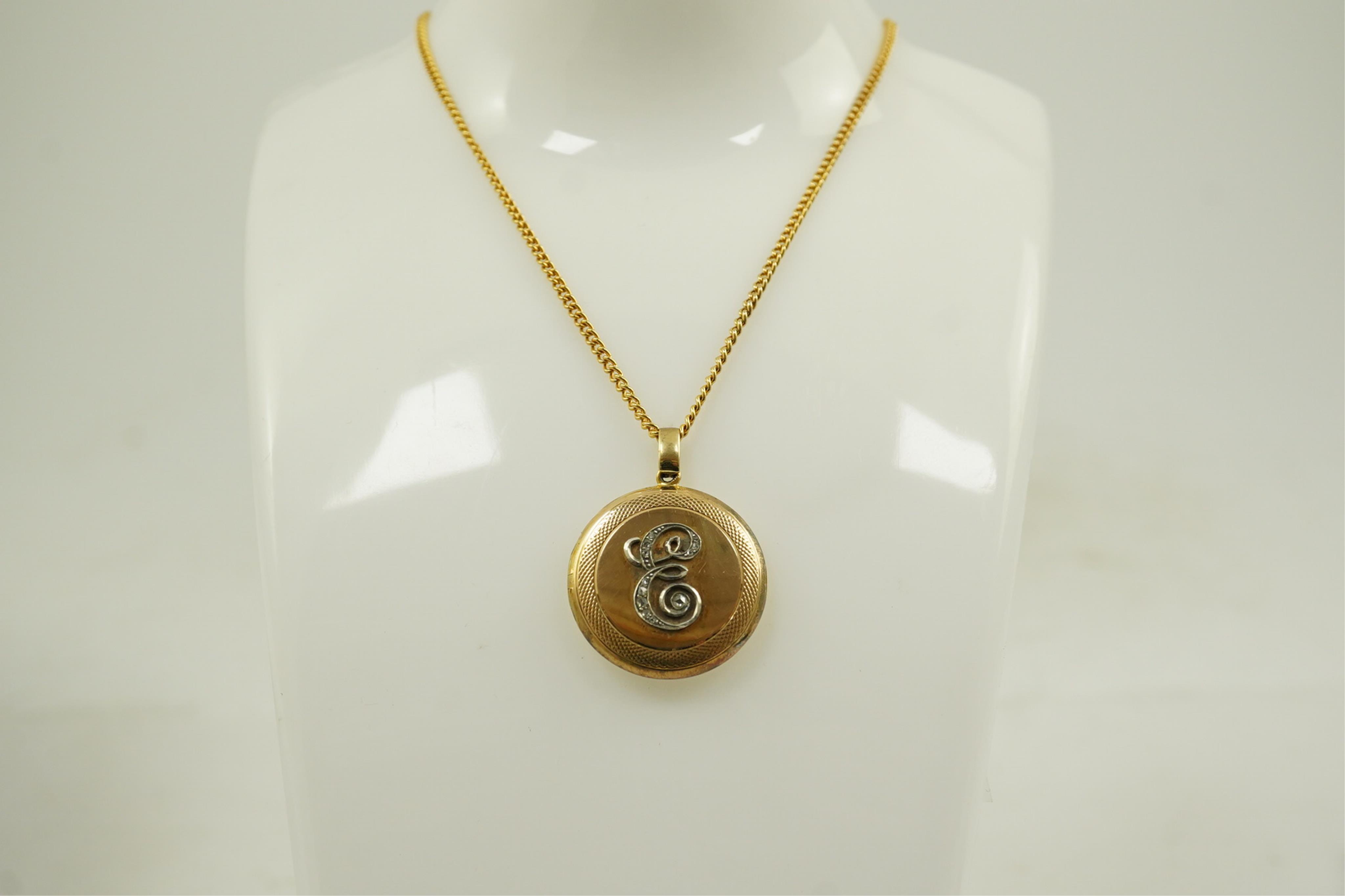 An early to mid 20th century 15ct gold and rose cut diamond cluster set circular 'initial' locket